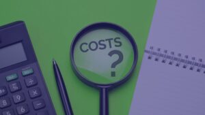 A magnifying glass focuses on the text "COSTS?" next to a calculator, pen, and notebook.