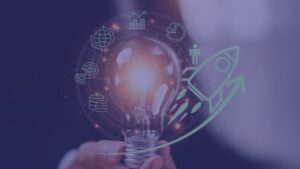 A glowing lightbulb held in a hand, surrounded by digital business icons and a soaring rocket ship overlay.