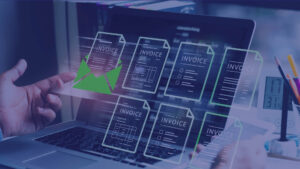 Digital invoices floating over a laptop screen illustrating the transition to an invoice finance facility.